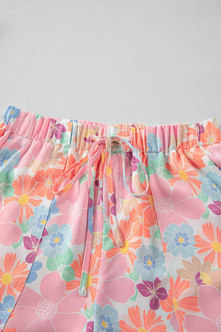 a close up of a pink flowered shorts