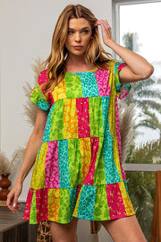 a woman in a colorful dress posing for a picture