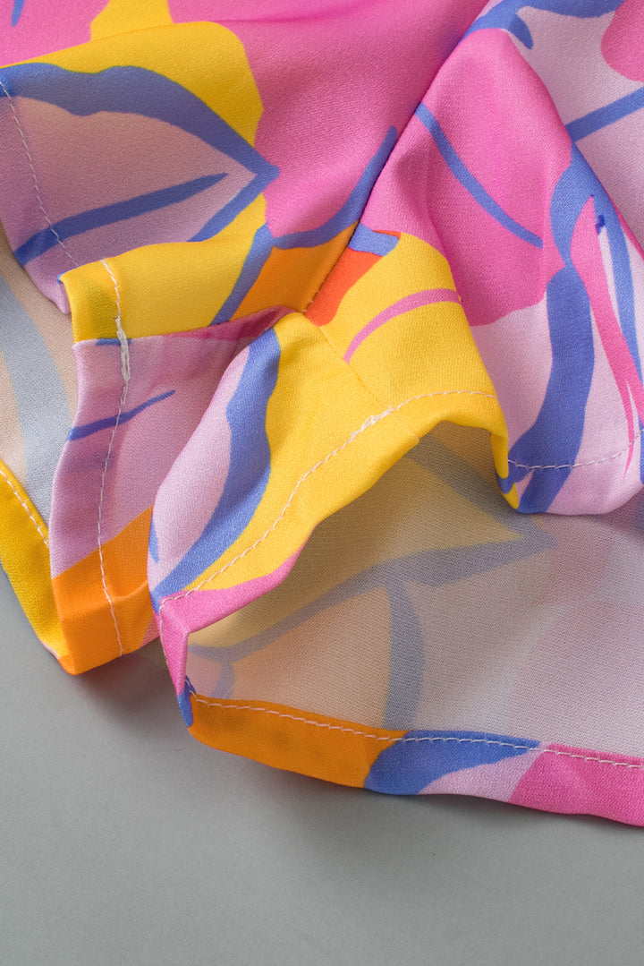 a close up of a pink, yellow, and blue scarf