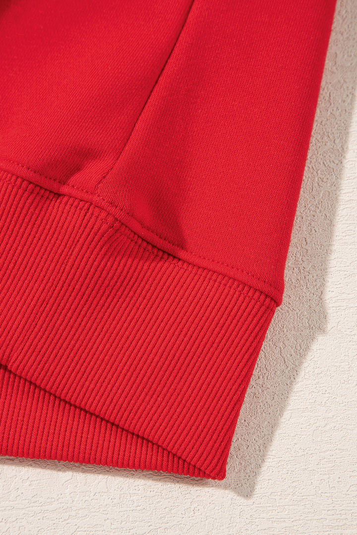 Bottom hem detail of Red Merry Christmas Crewneck Drop Shoulder Loose Sweatshirt with ribbed finish, available at Faith & Co. Boutique.