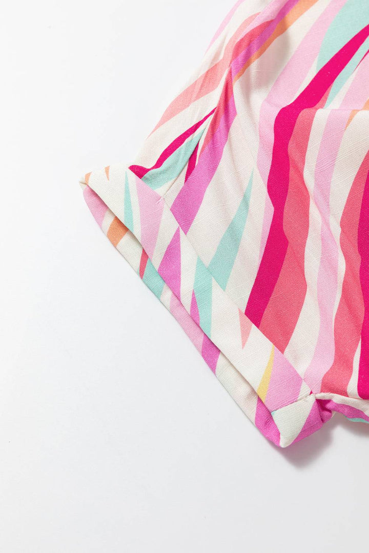 a close up of a pink, blue, and green striped fabric