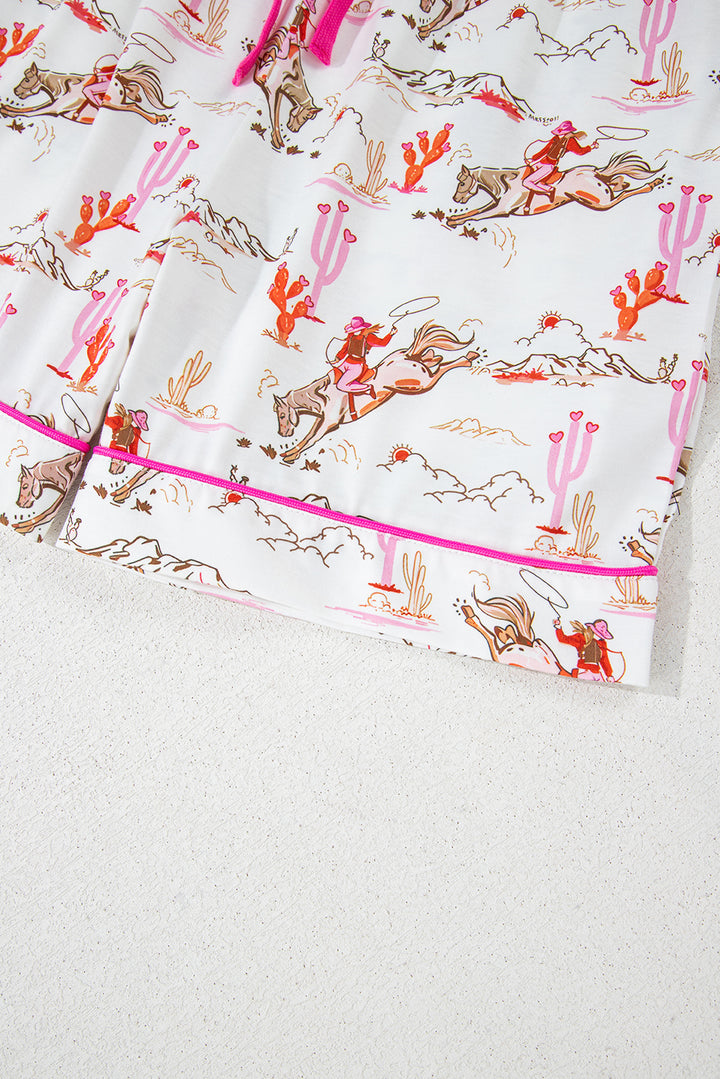Elastic waistband and pink drawstring on shorts from White Cowgirl Country Print Pajamas Set. Shop White Cowgirl Country Print Pajamas Set at Faith & Co. Boutique.