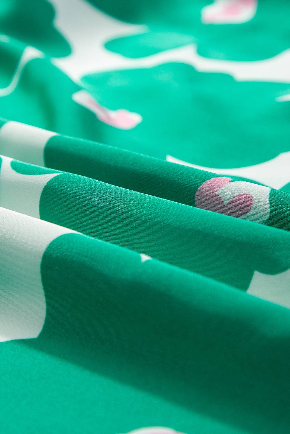 a close up of a green and white fabric