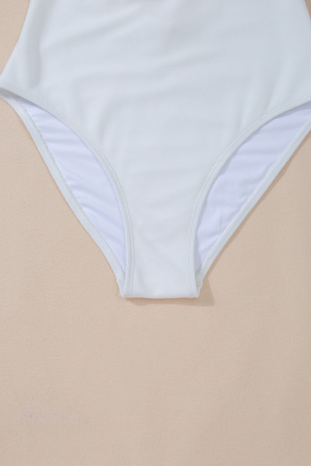 a women's white swimsuit with a high waist