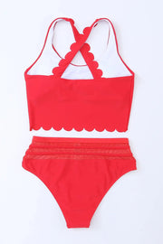a red and white swimsuit with scalloped straps