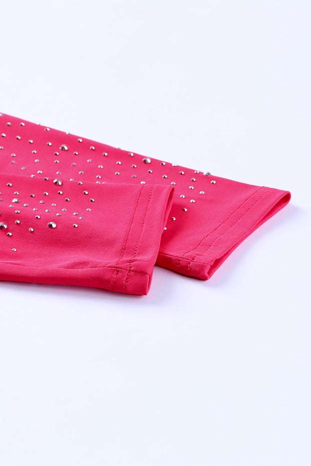 a pair of pink pants with silver studs on them