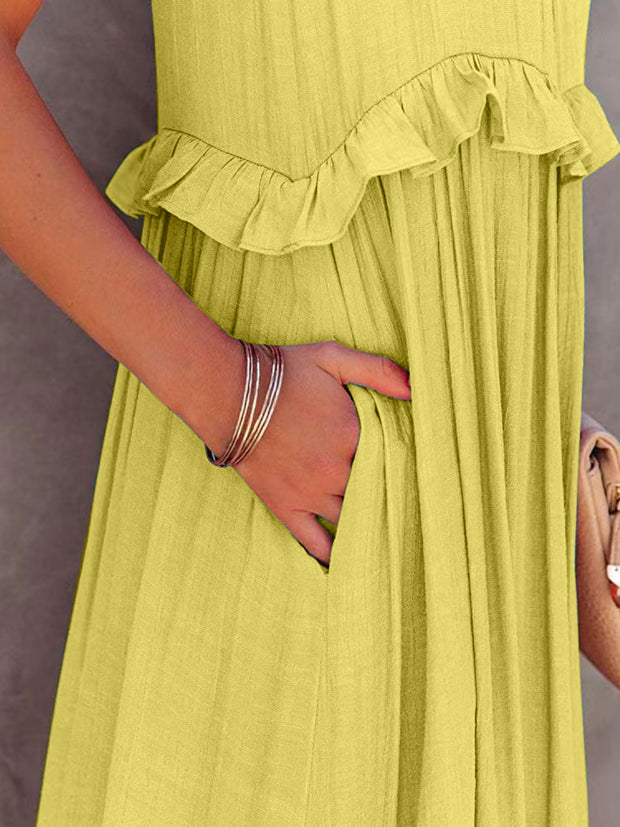 a woman in a yellow dress holding a purse