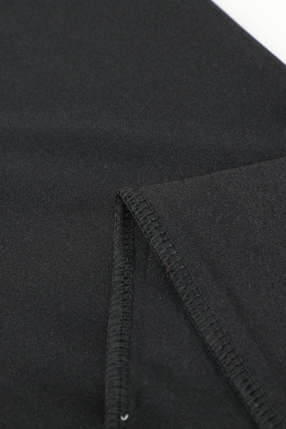 a close up of a black suit with a zipper