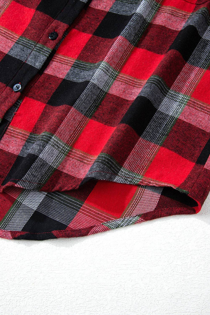 a red and black checkered shirt laying on a white surface