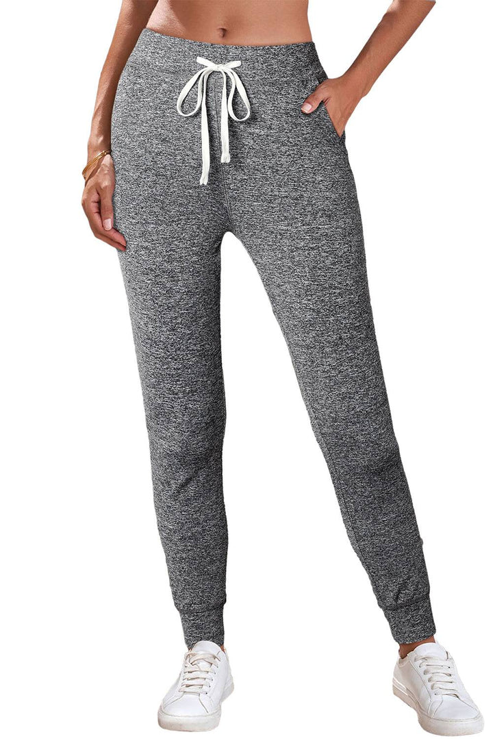 a woman wearing a pair of sweat pants