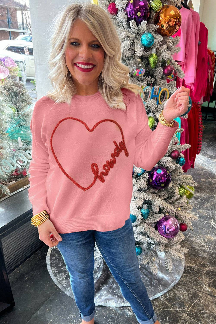 a woman standing in front of a christmas tree