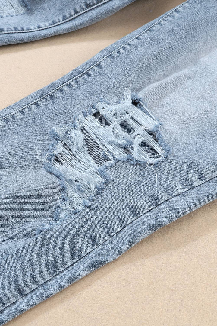 a pair of ripped jeans with a hole in the middle