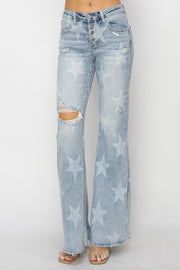 a woman wearing a pair of blue jeans with stars on them