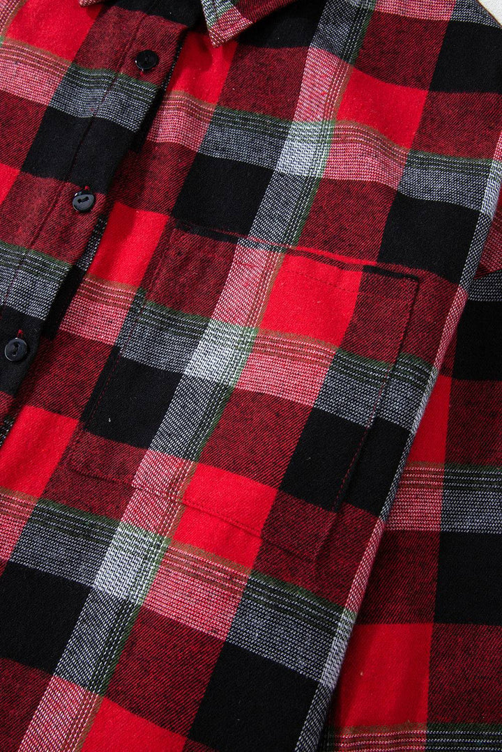 a close up of a red and black plaid shirt