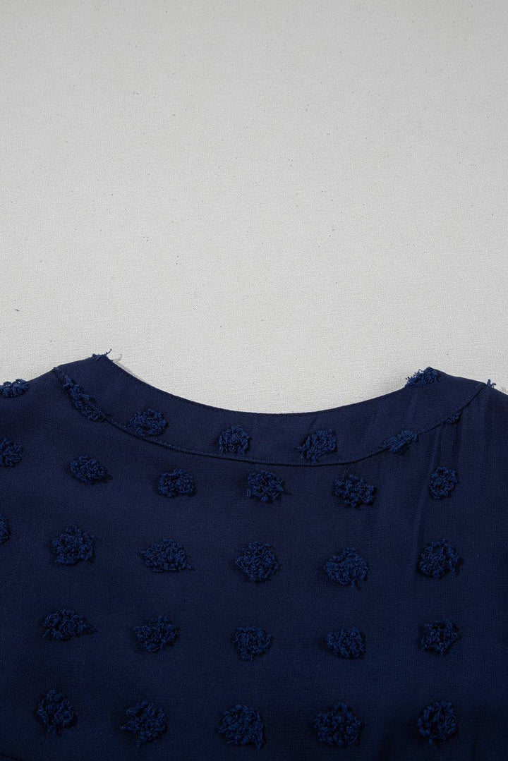 Neckline detail of Navy Blue Dotty Textured Notched Neck Plus Ruffled Dress, emphasizing soft collar and textured dot pattern.