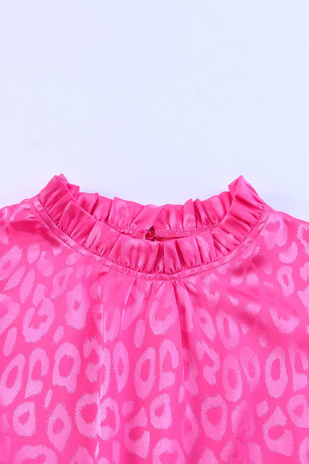 a close up of a pink top with a pattern on it