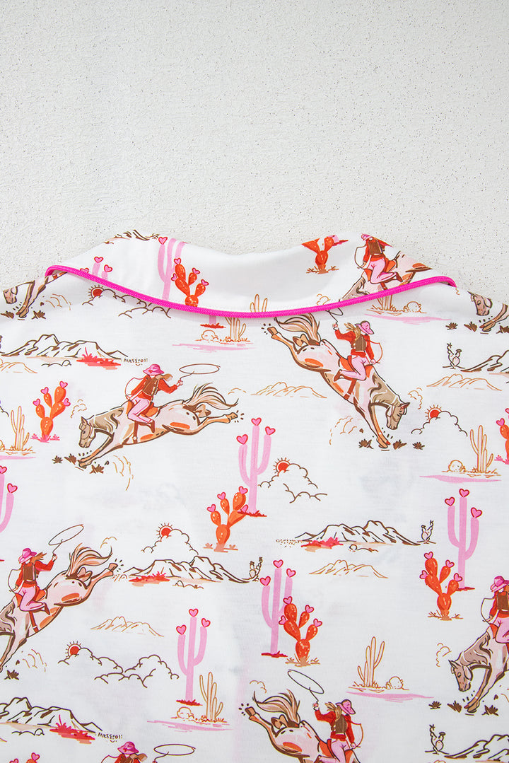 Sleeve hem detail of White Cowgirl Country Print Pajamas Set with pink trim and western motifs. Shop White Cowgirl Country Print Pajamas Set at Faith & Co. Boutique.