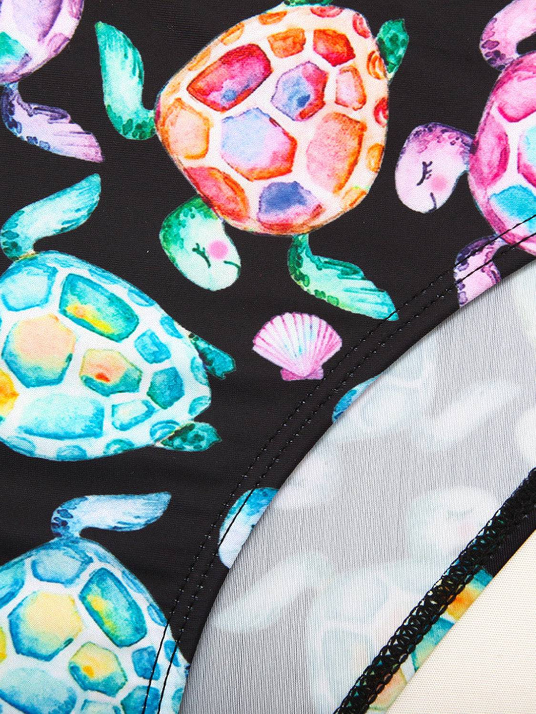 a close up of a bag with turtles on it