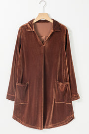 a brown jacket hanging on a hanger