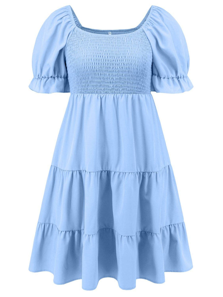 a light blue dress with ruffles on the shoulders