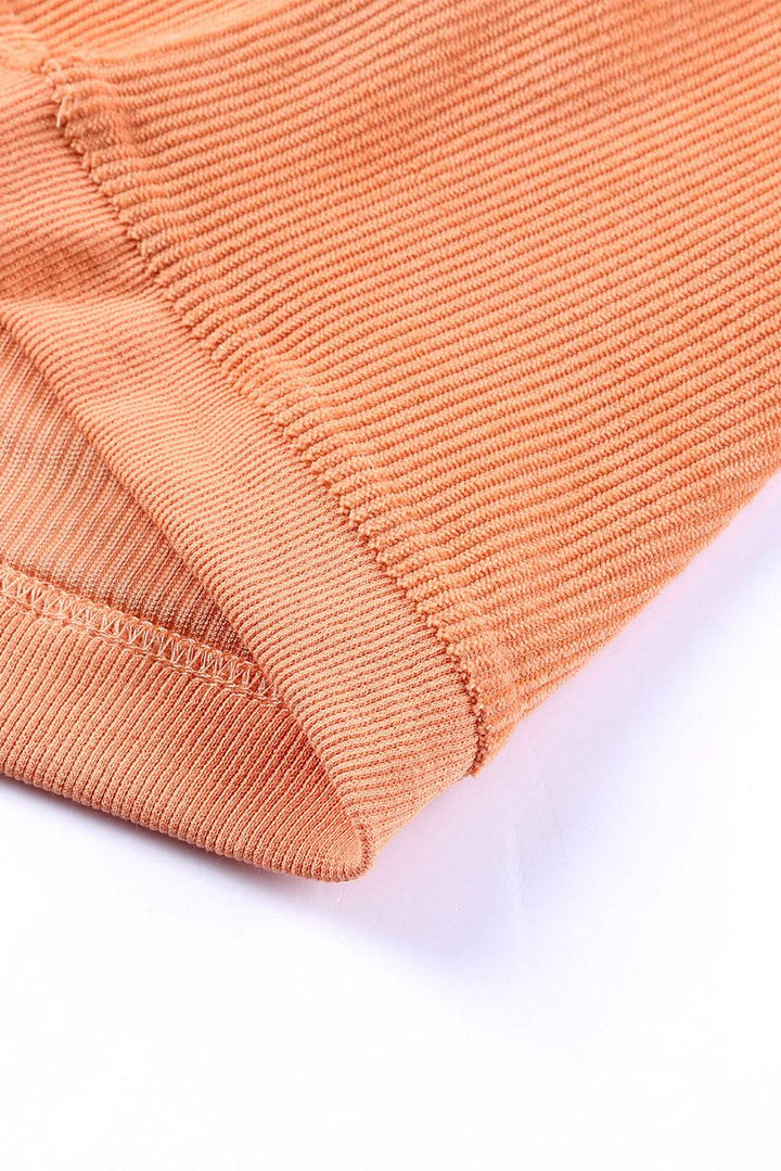 a close up view of the back of a pair of orange pants