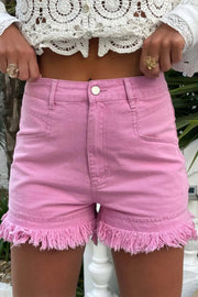 a close up of a person wearing pink shorts