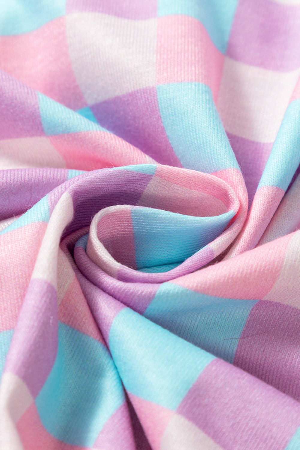 Fabric texture close-up of Purple Checkered Pattern Short Sleeve Pajamas Set showing soft, breathable material in pastel tones.