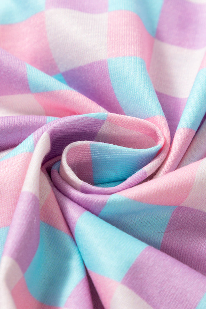 Fabric texture close-up of Purple Checkered Pattern Short Sleeve Pajamas Set showing soft, breathable material in pastel tones.