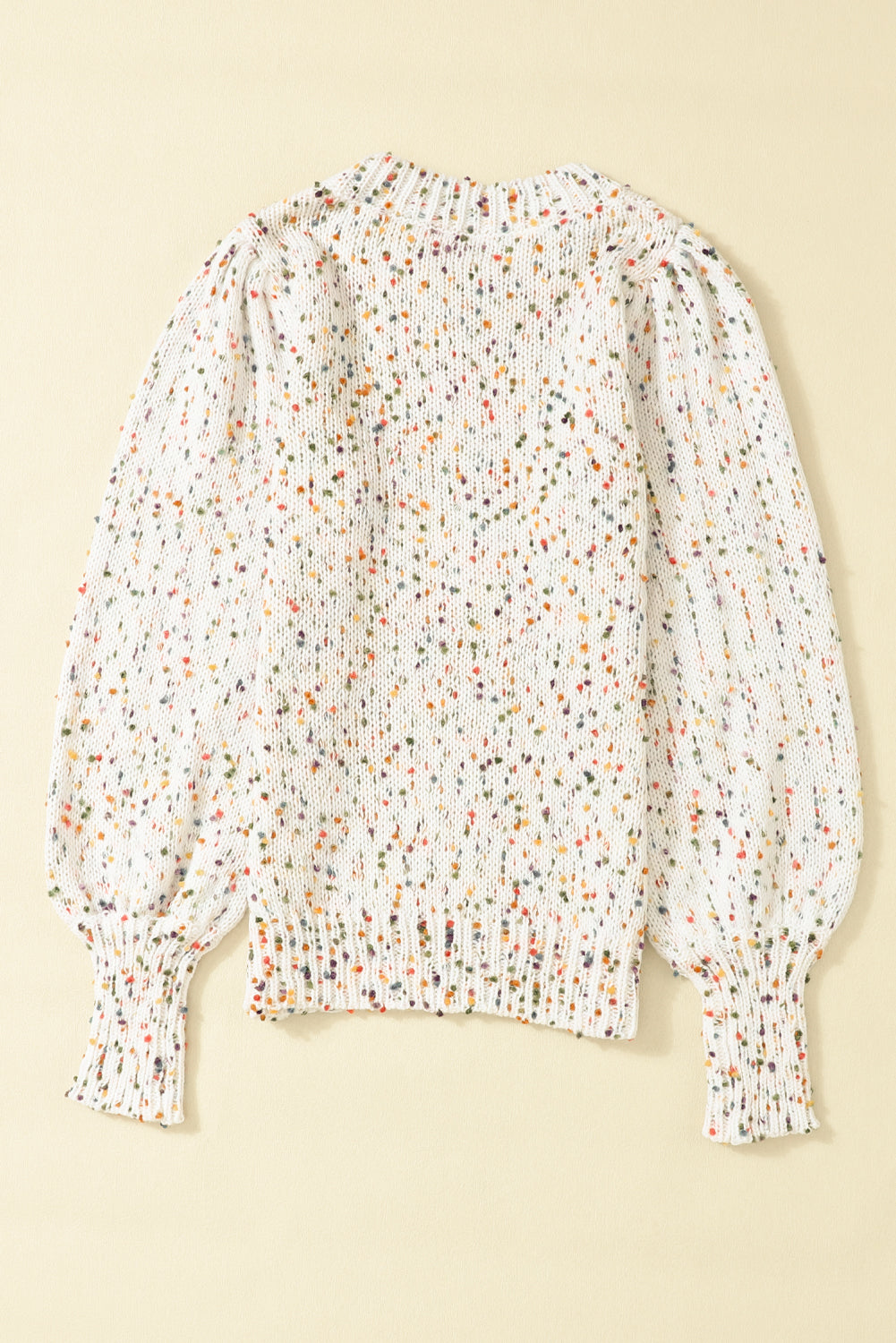 a white blouse with multicolored dots on it