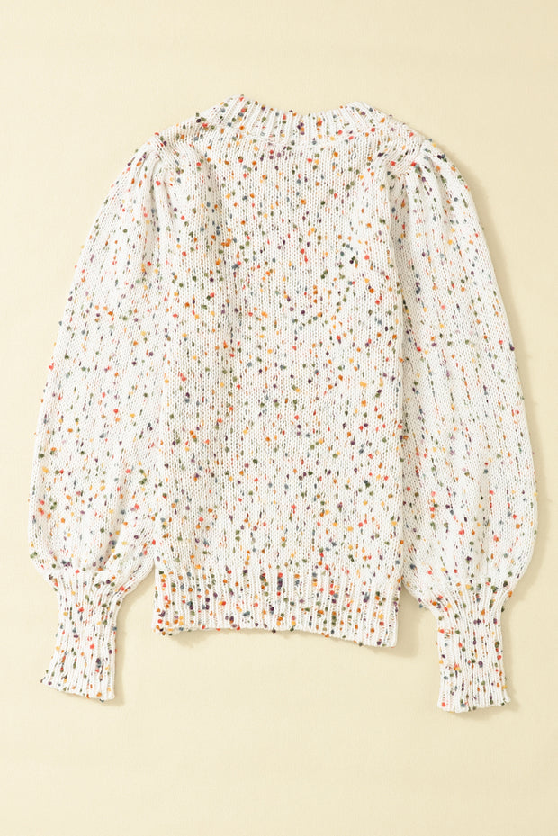 a white blouse with multicolored dots on it