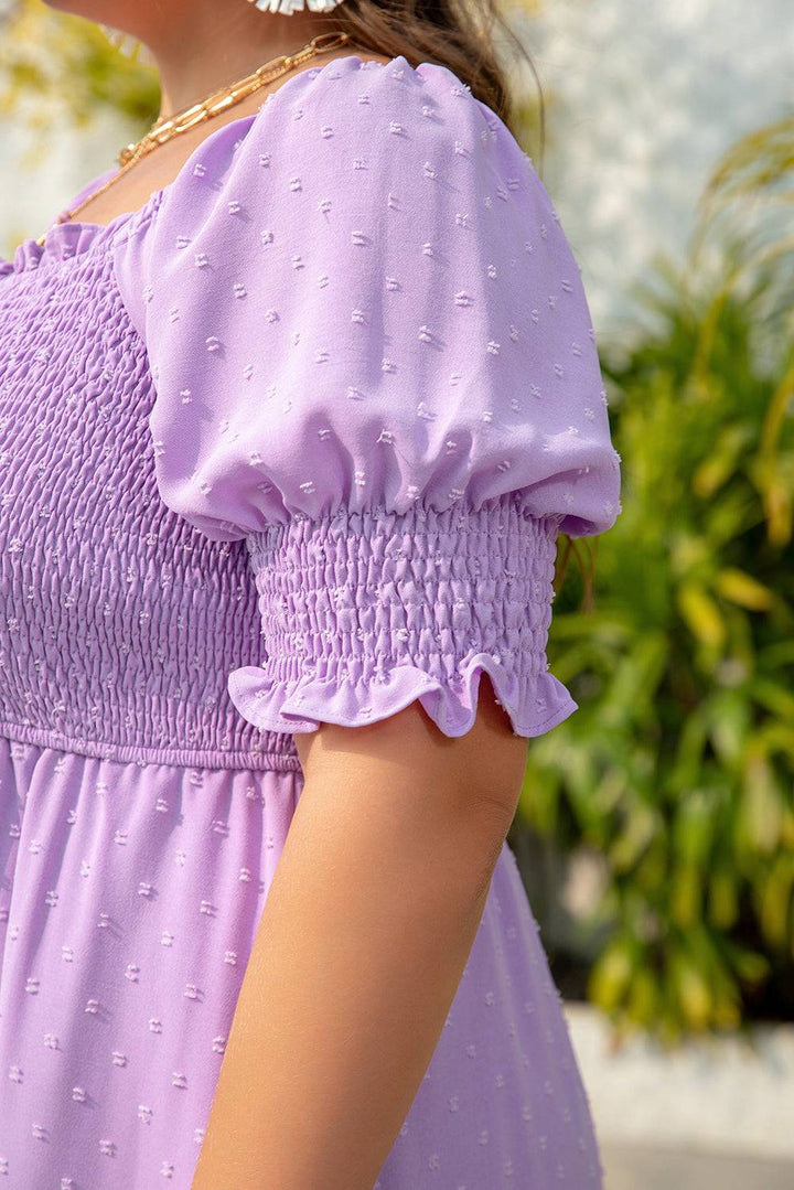 Wisteria Swiss Dot Smocked Frilled Neckline Plus Size Dress on hanger, showing full front design with frilled neckline and puff sleeves.