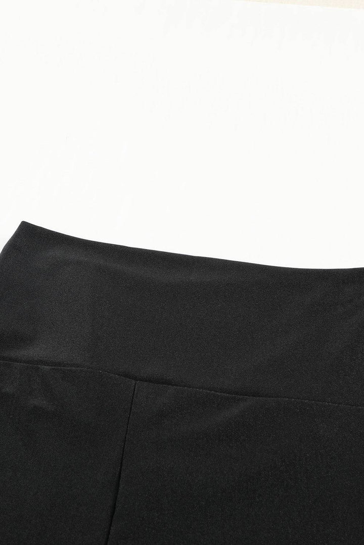 a close up of a black skirt on a white background