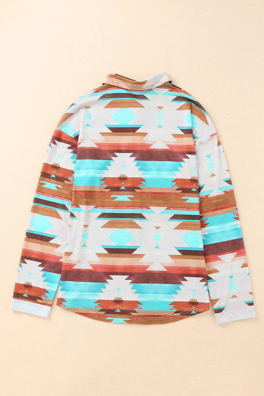 a long sleeved shirt with a colorful pattern on it