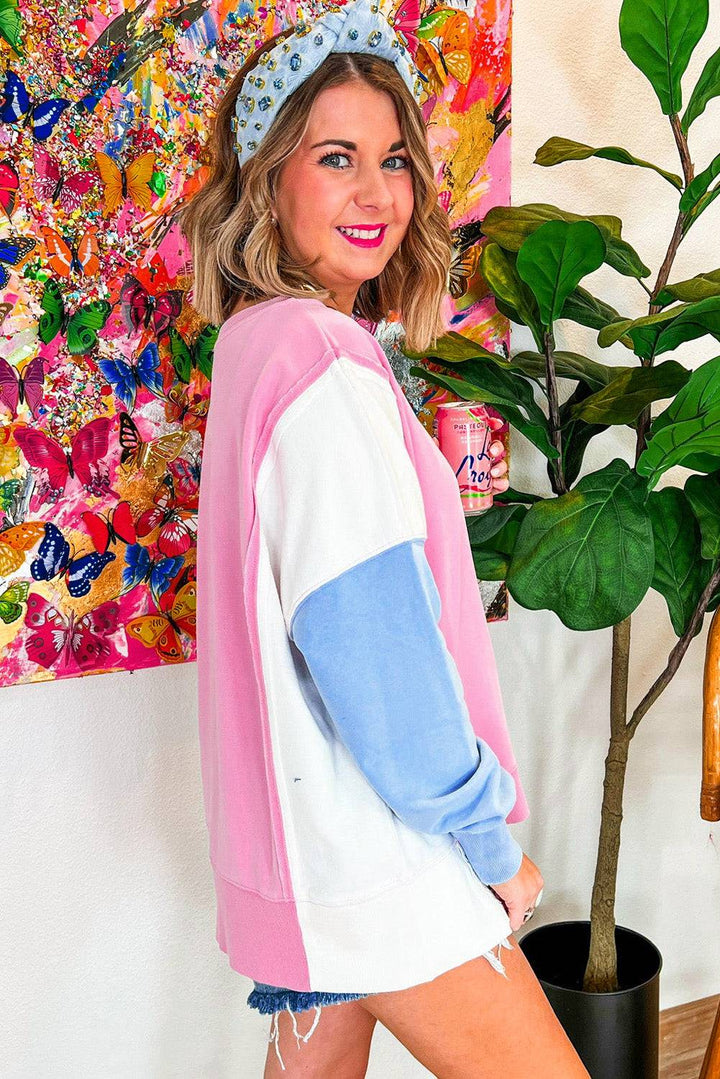 a woman standing next to a potted plant