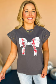a woman wearing a baseball bow t - shirt