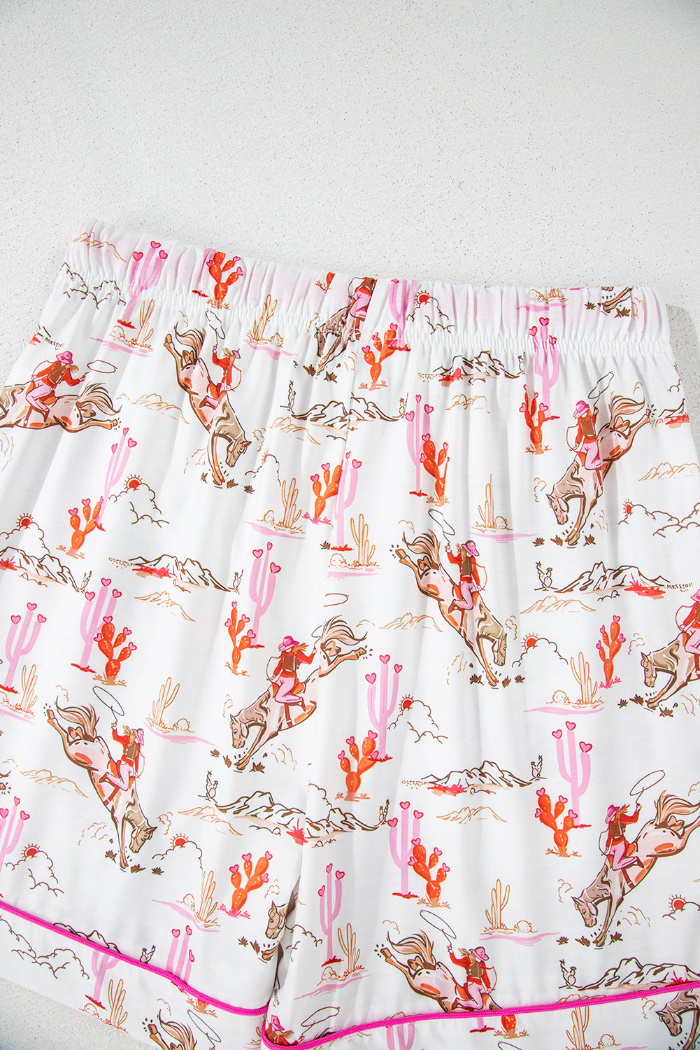 Detail of bright pink drawstring on shorts from White Cowgirl Country Print Pajamas Set. Shop White Cowgirl Country Print Pajamas Set at Faith & Co. Boutique.