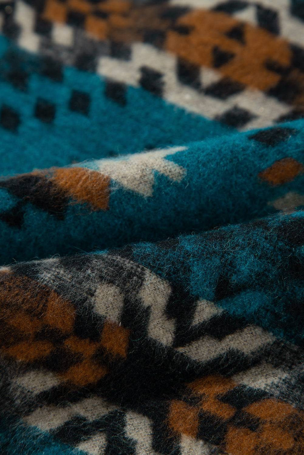 a close up of a blue and brown rug