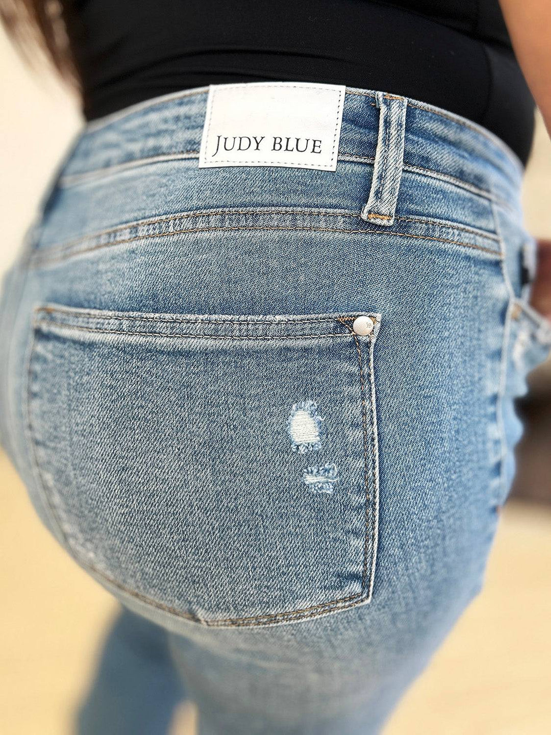 a close up of a person's butt with a label on it