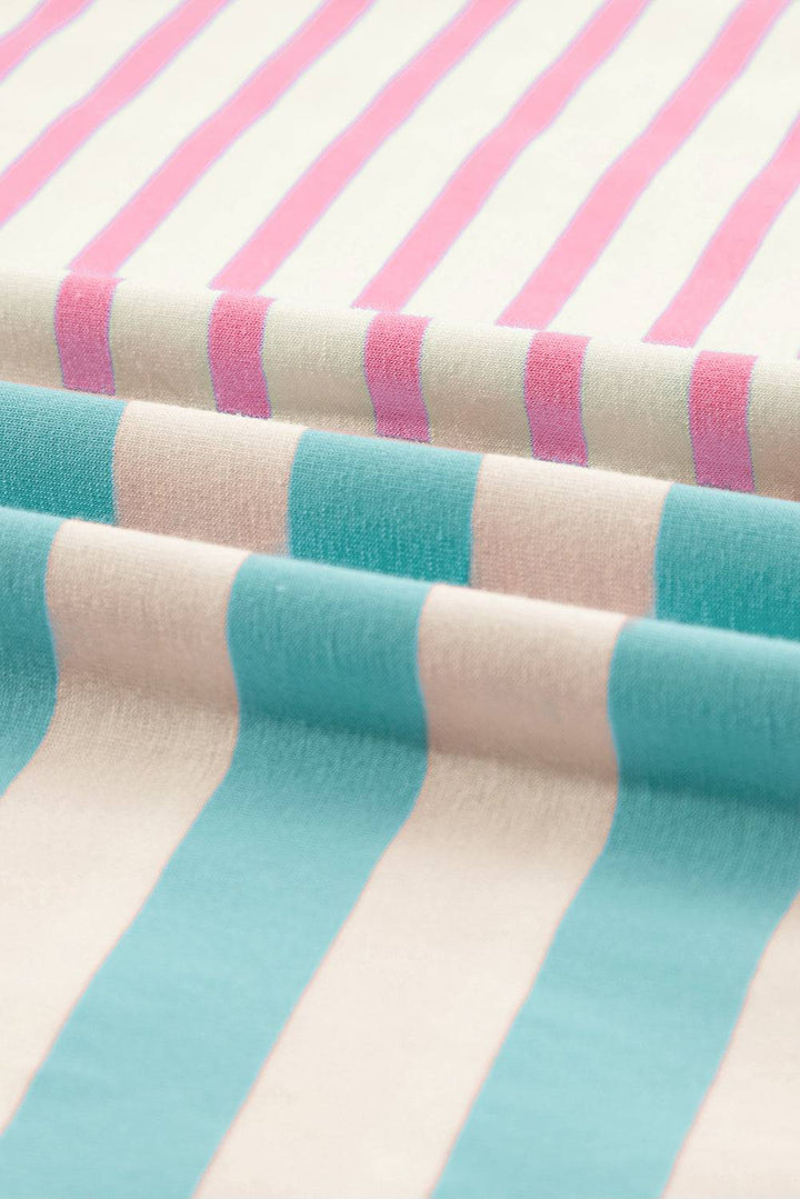 a close up of a pink and blue striped fabric