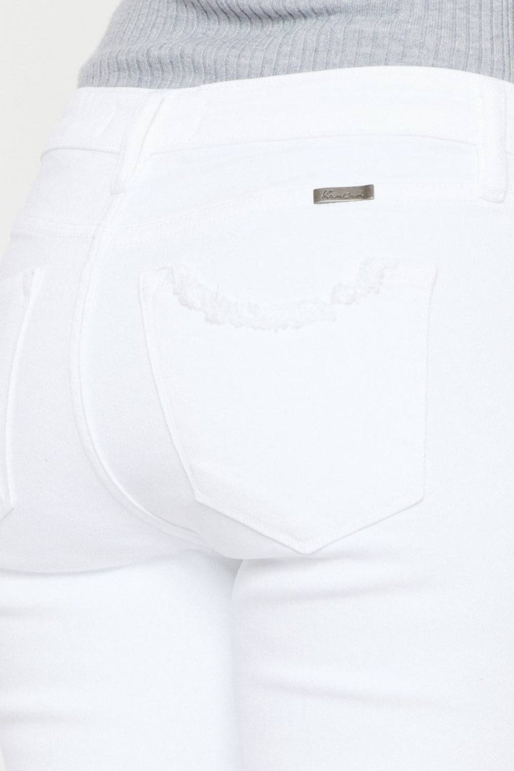 a close up of a person wearing white jeans