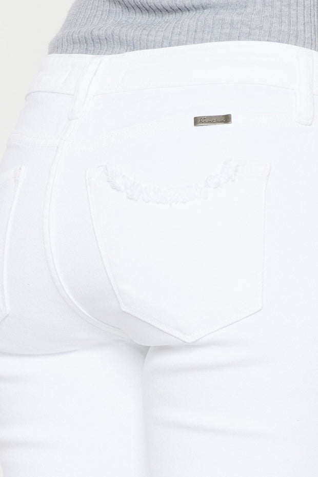 a close up of a person wearing white jeans
