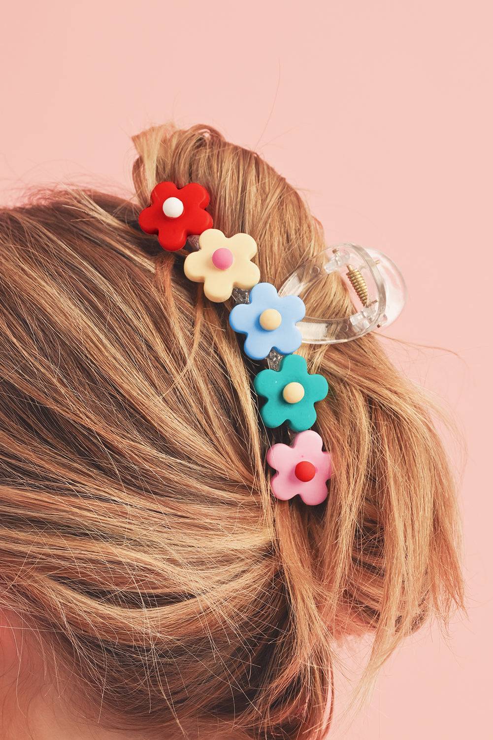 a close up of a person with a hair clip in their hair