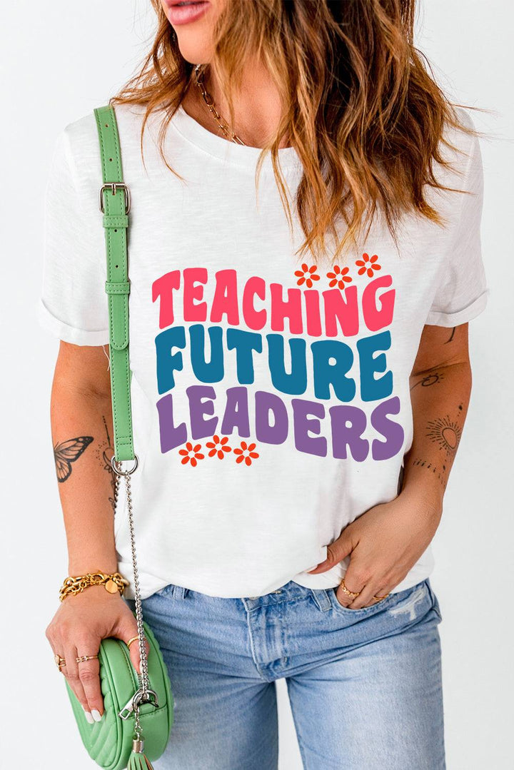 a woman wearing a t - shirt that says teaching future leaders