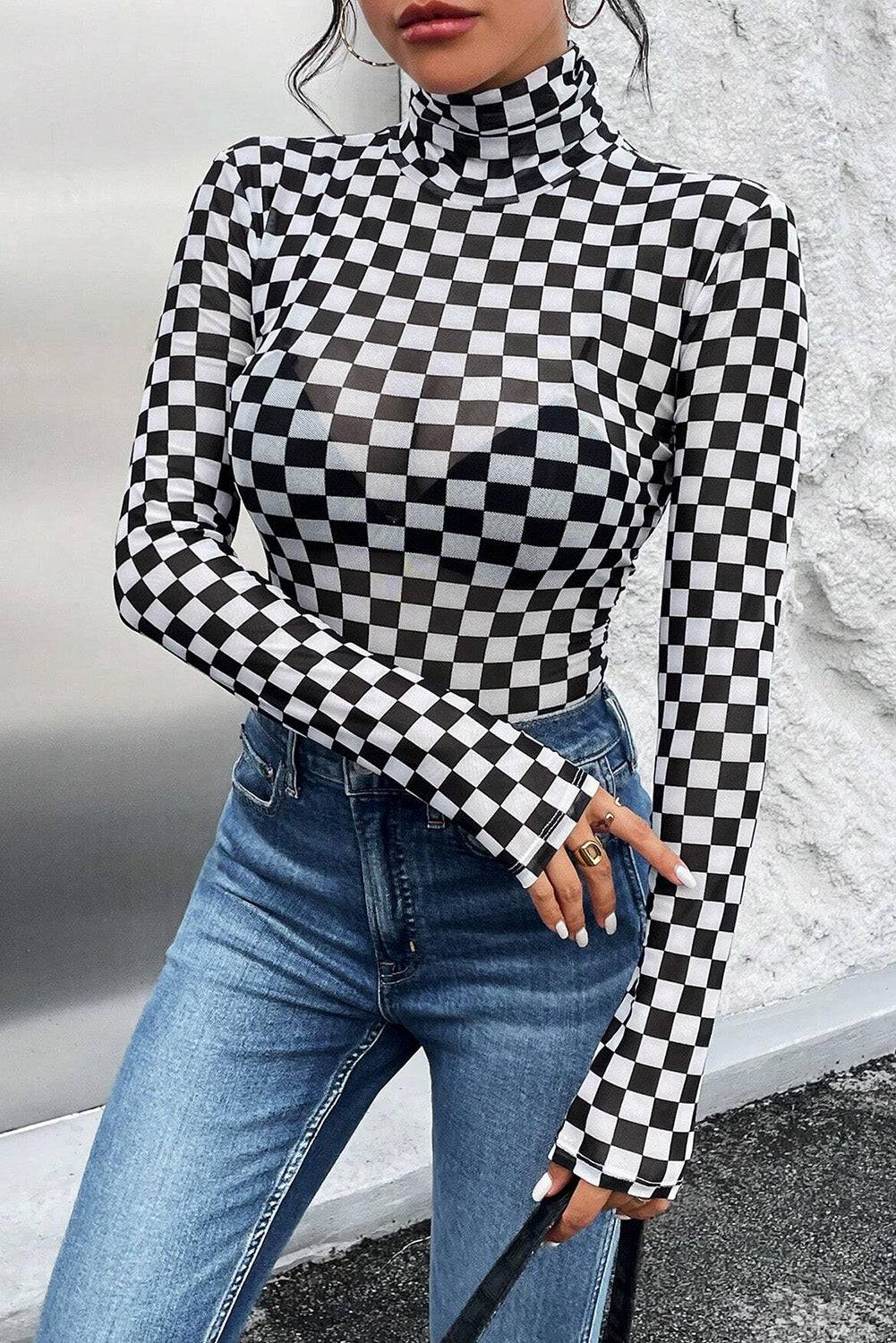 a woman wearing a black and white checkered top