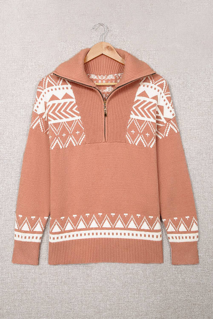 a brown sweater with a white pattern on it