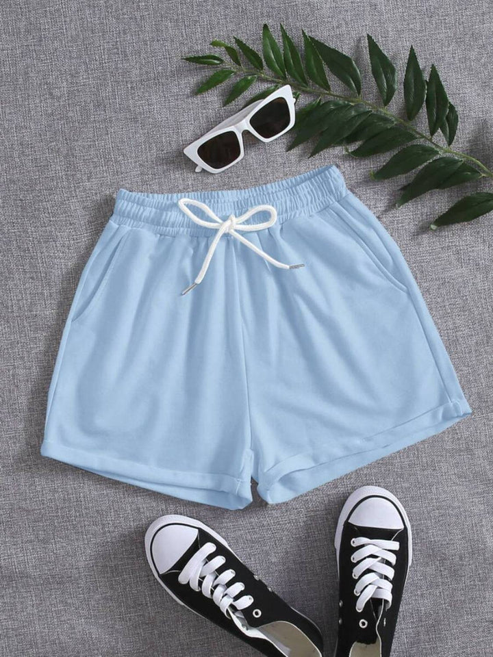 a pair of sneakers and a pair of blue shorts