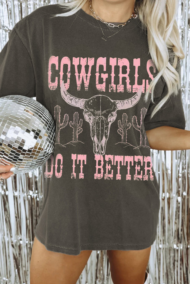 a woman holding a disco ball and wearing a cowgirl shirt