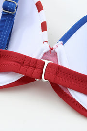 a close up of a red, white and blue bow tie