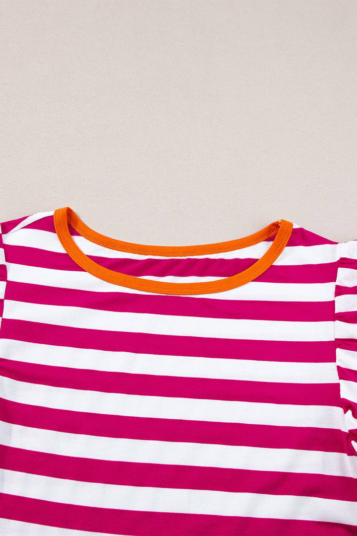 a pink and white striped shirt with orange trim