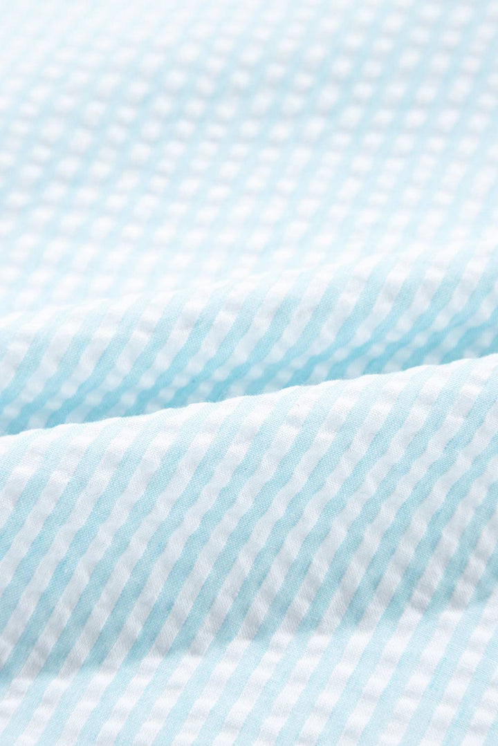 a close up of a blue and white checkered fabric